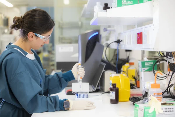 Scientists in lab pipetting samples for biomarker testing on The MesoScale Discovery platform (MSD)