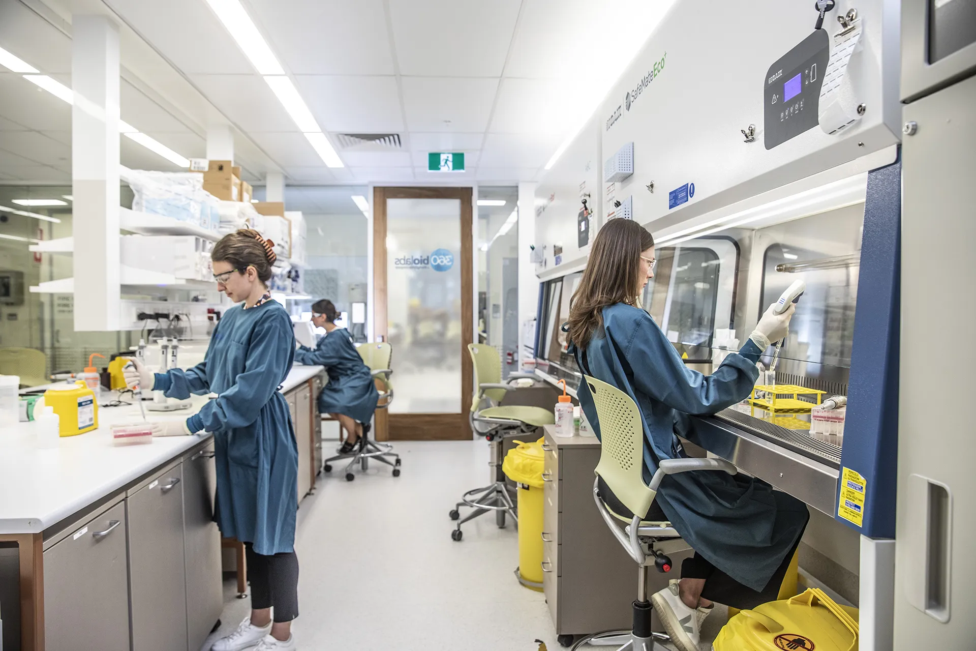 Team of high performing scientists working together in state-of-the-art laboratory conducting bioanalytical testing