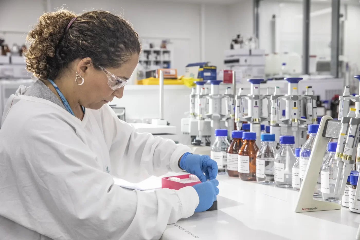 Scientists preparing samples in chemistry laboratory for LC-MS/MS analysis