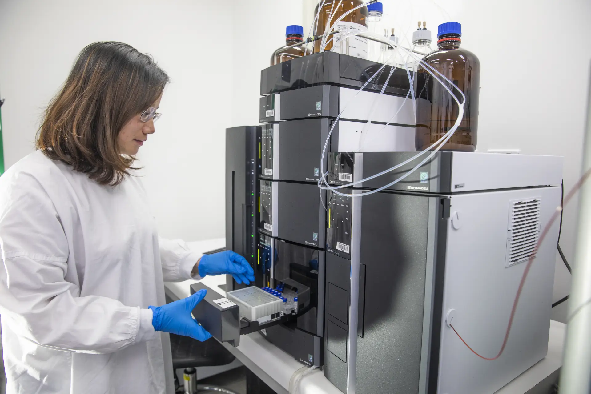 Scientist working with Agilent systems LC-MS/MS instrument