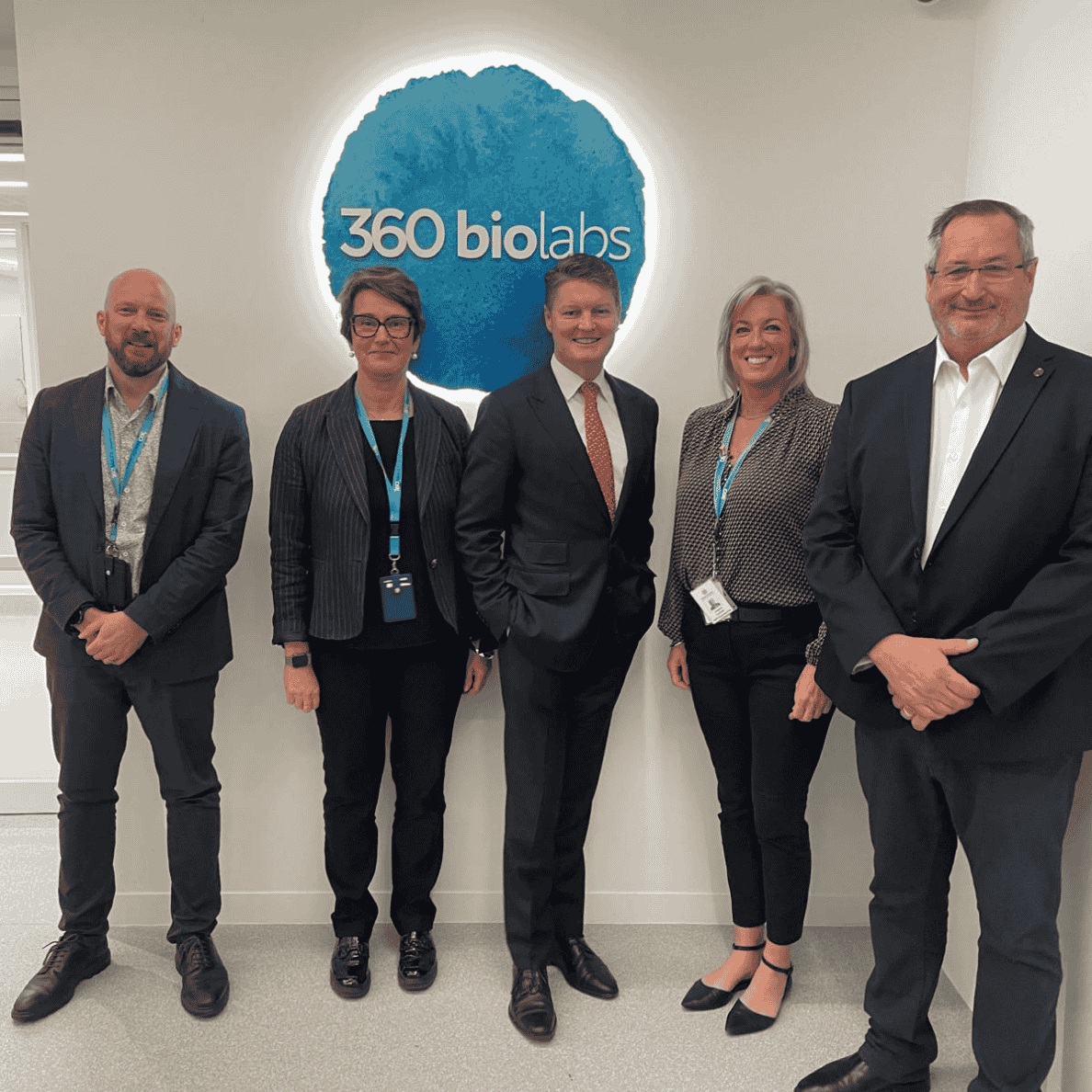 group of 5 people standing in front of 36biolabs sign