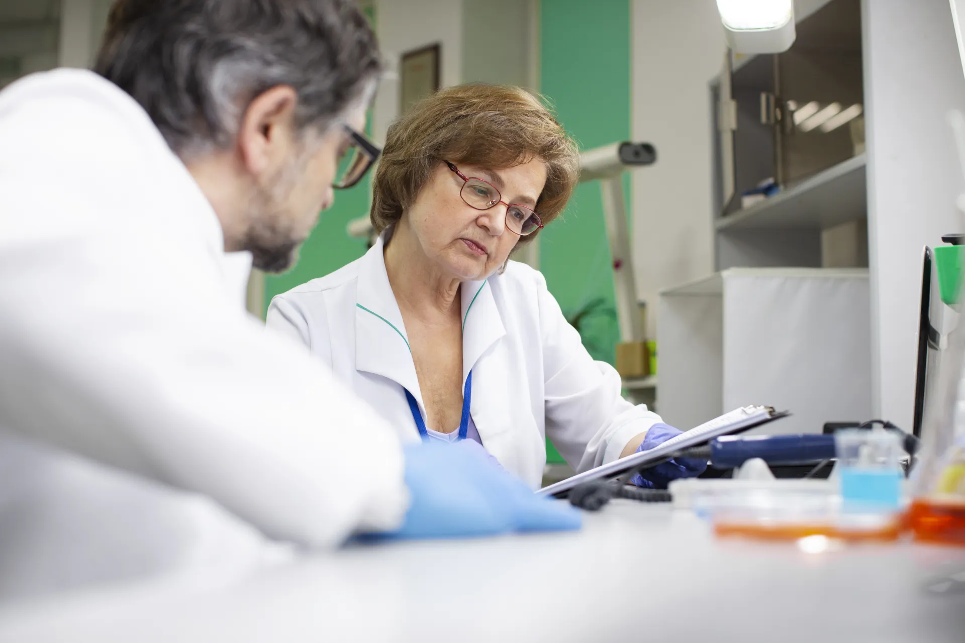 Two scientists reviewing a laboratory at a clinical site or Phase 1 unit